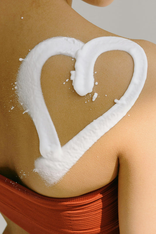 Lathered heart symbol on back of ladies shoulder