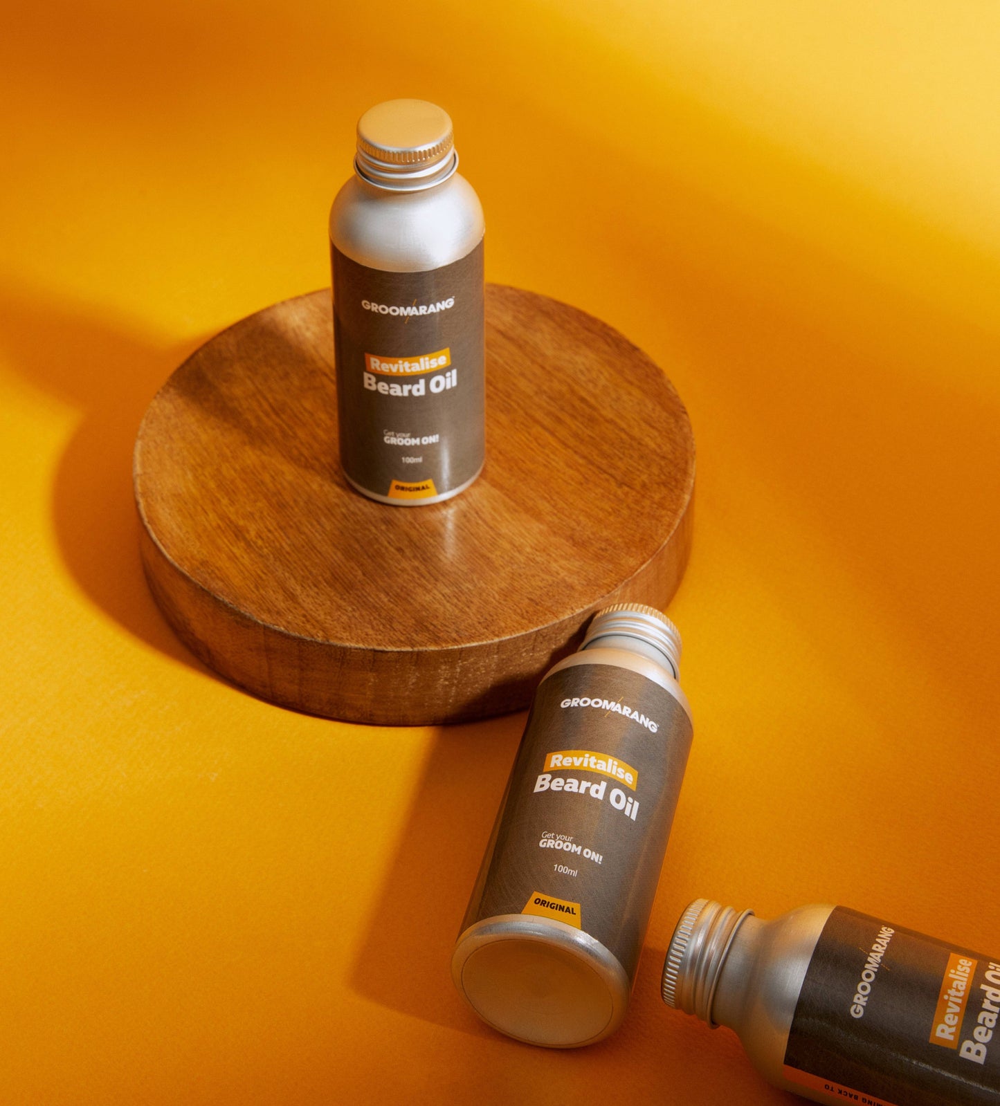 3 metal bottles of beard oil with screw tops