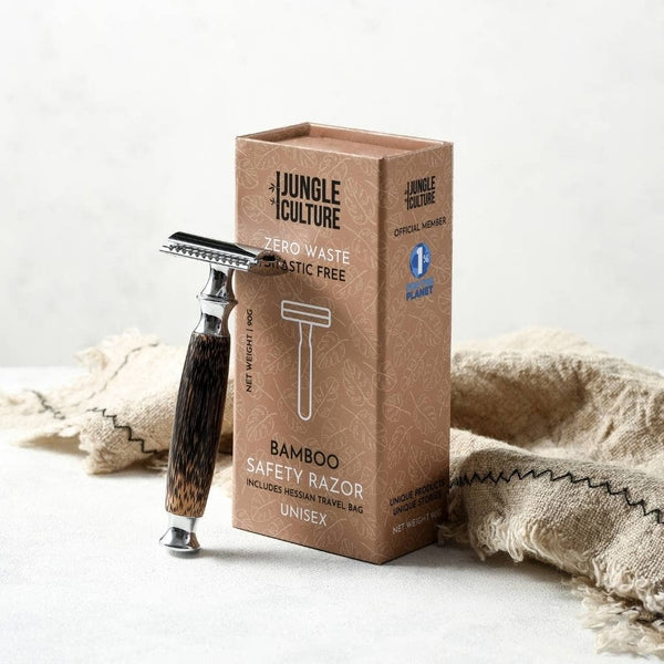Bamboo safety razor with Jungle Culture packaging on a light background