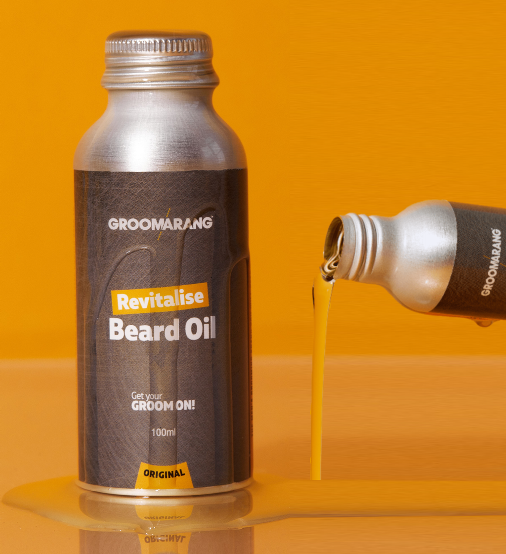 1 bottle of metail beard oil with label and 1 bottle of oil flowing out of it
