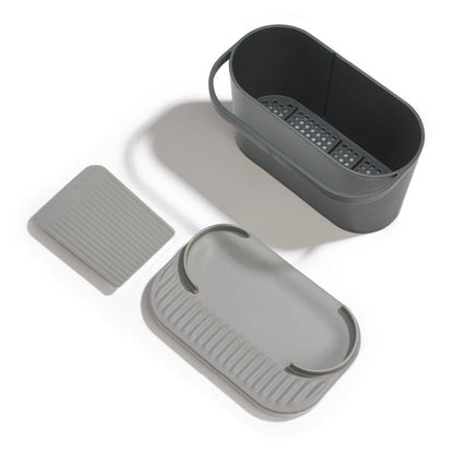 Set of grey recycled storage containers with lids on a white background