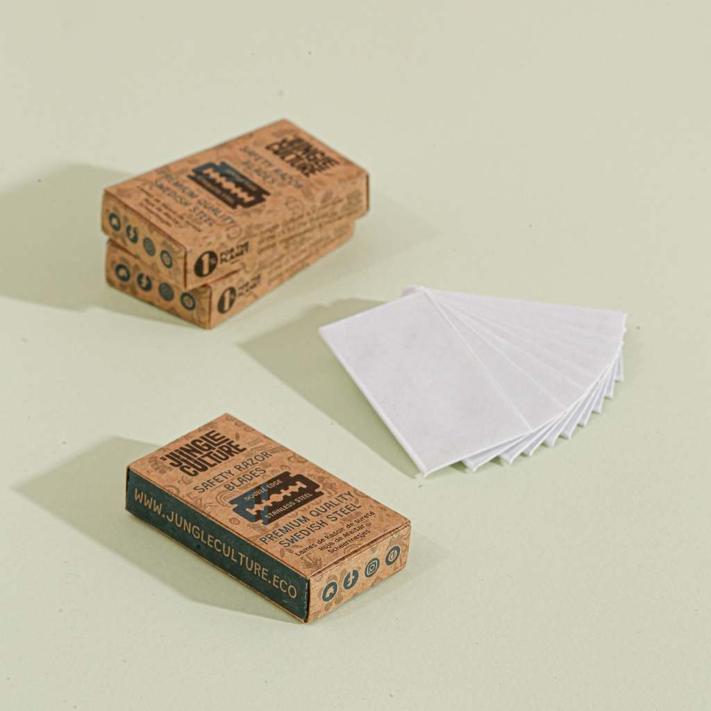 Two boxes of Jungle Culture bamboo toothbrushes on a light beige background