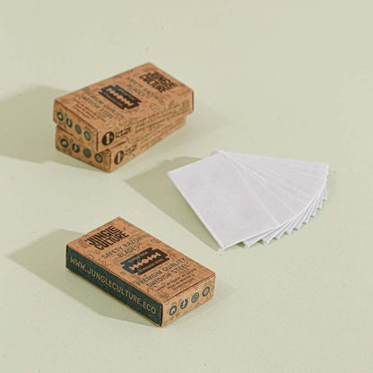 Two boxes of Jungle Culture bamboo toothbrushes on a light beige background