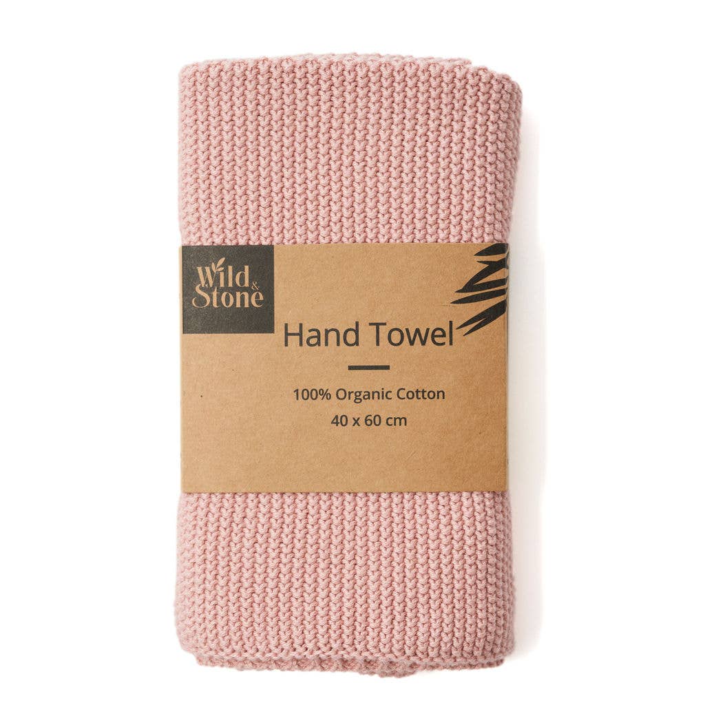 Rose hand towel with a 'Wild Stone' label on a white background