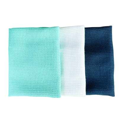three SEEP  square textured microfiber free cloths in mint green, white, and dark blue, arranged side-by-side on a plain white background.